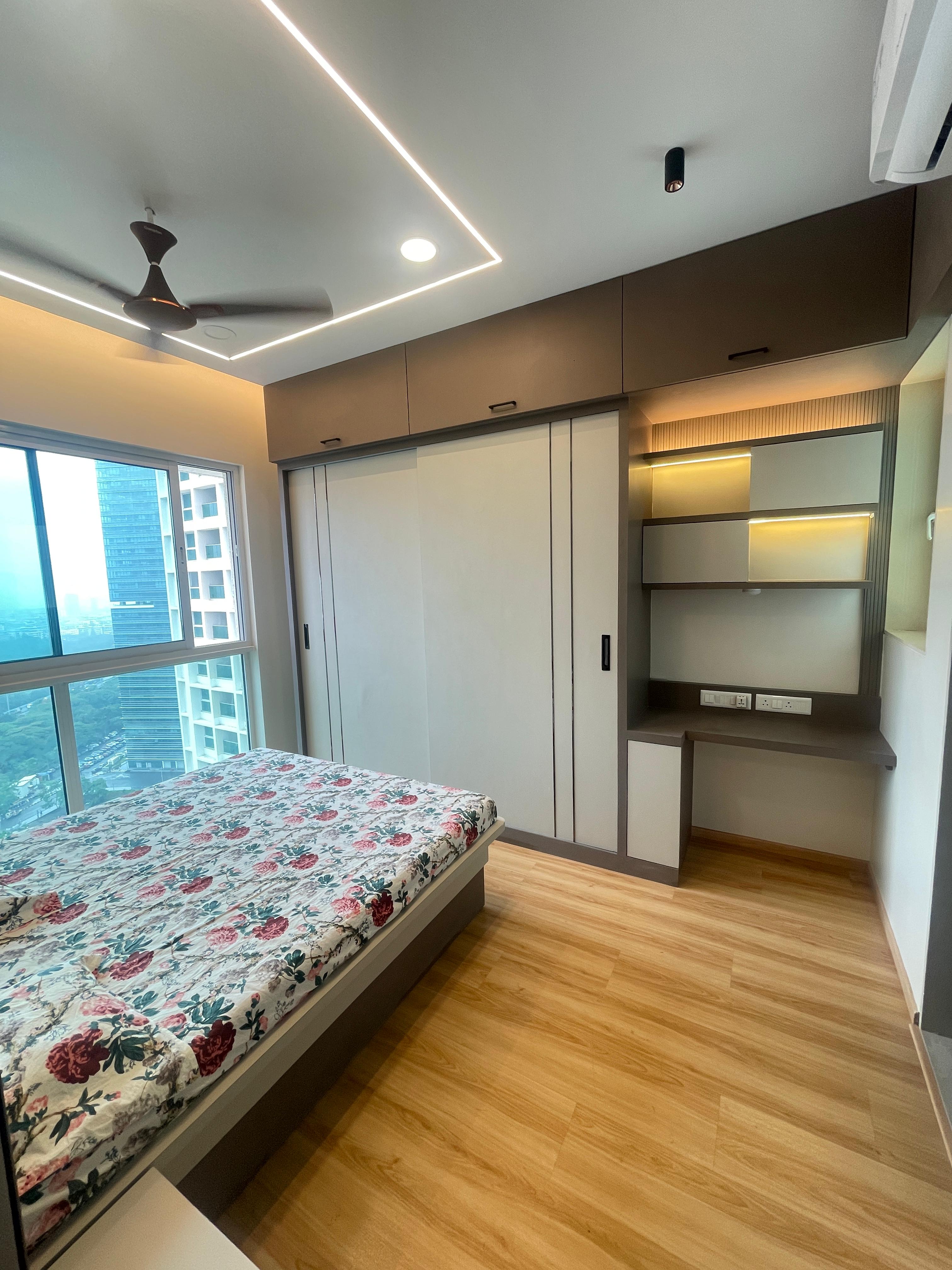 Bedroom with upholstered headboard and large window